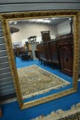 A modern gilt over mantel wall mirror, approx. 135 x 105cm