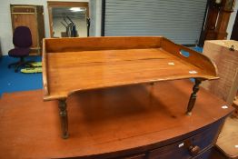 A Victorian mahogany bed tray