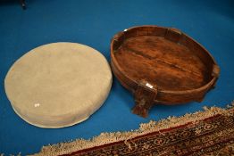 An Indian style Chakki table , having additional upholstered suede cushion, diameter approx. 75cm