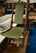 A 19th Century campaing style folding chair having later dralon upholstery