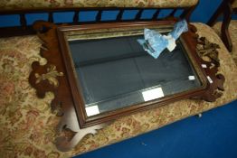 A 19th Century mahogany framed mirror having gilt work decoration and eagle, height approx 94cm