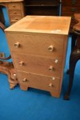 A vintage light oak three drawer bedside chest , approx dimensions W46 D43 H72cm