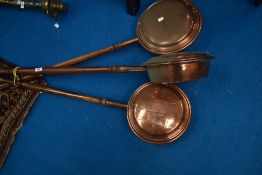 Three vintage copper bed warming pans