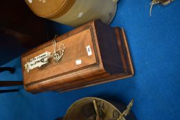 A vintage Frister & Rossman sewing machine in wood case