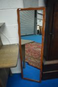 A vintage teak full length wall mirror
