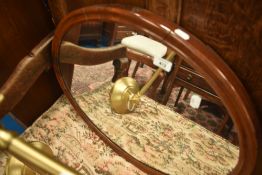 An early 20th Century oval wall mirror