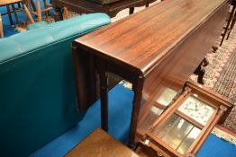 A 19th Century mahogany drop leaf table of narrow proportions on tuned frame, width approx. 122cm