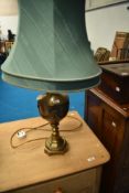 A modern brass table lamp modelled as urn with swag decoration