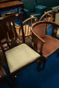 An Edwardian mahogany tub chair and a Georgian style mahogany scroll back dining chair