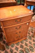 A reproduction Yew Wood bedside chest of four drawers, dimensions approx. W46 D36 H66