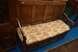 A period oak box settle of four panel form, width approx 151cm