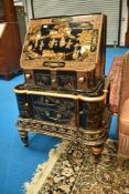 A Chinese style black laquered and gilt bureau