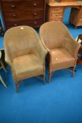 Two vintage Lloyd Loom tub chairs