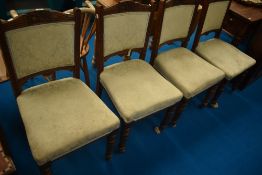 A set of four Victorian upholstered dining chairs