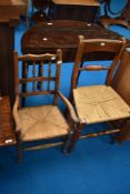 A 19th Century childs carver chair having spindle back and rush seat and a similar period kitchen
