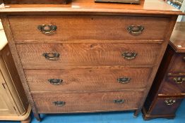 An early 20th Century oak chest of four drawers having ledge back, width approx. 107cm