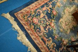 A Chinese rug having blue ground and multi coloured foliate decoration, approx 148 x 245cm