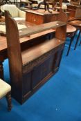 An early to mid 20th Century oak shelf with cupboard under, having open back, width approx. 97cm