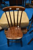 A traditional childs spindle back chair