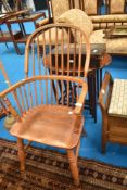 A traditional Windsor style hoop and stick back carver chair