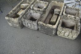 A selection of reconstituted garden planters