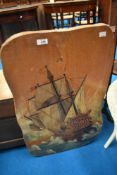 A rustic firescreen having galleon decoration