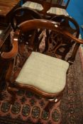 A reproduction corner elbow chair, having tweed upholstered seat