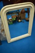 A modern painted wall mirror