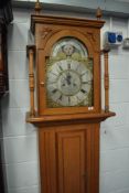 A traditional long cased clock having 8 day movement with brass and silvered dial named for Edward