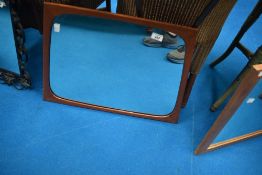 A vintage teak wall mirror