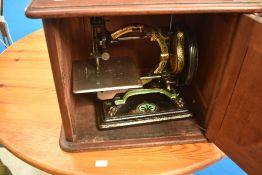A Victorian hand crank sewing machine, Royal Sewing Machine 'Shakespeare' model, in mahogany case,