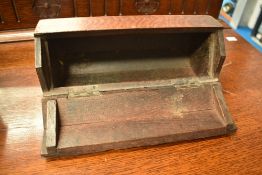 A 19th Century oak candle box of octagonal cylinder form, with drilled foot