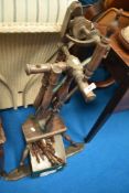 A traditional oak spinning wheel, in need of some repair , includes spares