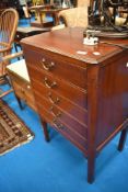 A late 19th or early 20th Century mahogany music cabinet