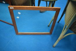 A golden oak frame wall mirror