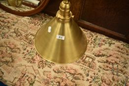 A modern brass angle ceiling light fitting