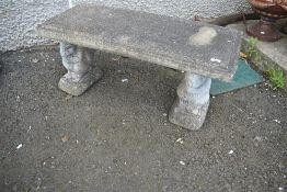 A concrete garden seat having squirrel supports
