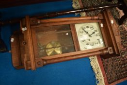 An early 20th Century oak cased wall clock