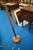 A traditional oak standard lamp