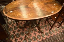 A Victorian inlaid occasional table of oval form, approx 92 x 53cm