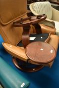 A Stressless easy chair with swing out table and footstool