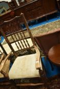 A 19th Century spindle back carver chair