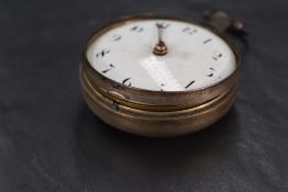 A George III silver key wound open face pocket watch, the white dial with Arabic numerals, within
