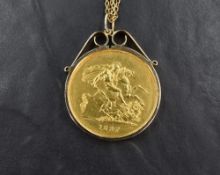 A gold 1887 five pound coin, set in a 9ct gold mount suspended on 9ct gold double belcher chain with