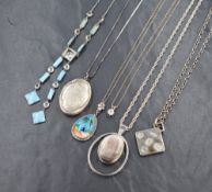 Six silver and white metal pendants with chains including silver ingot, locket, butterfly wing