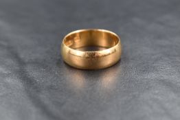 An 18ct gold wedding band, ring size T-U, 8.3g