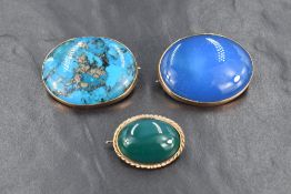 Three semi-precious cabochon brooches, set in yellow metal marked 9ct, including turquoise with