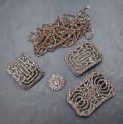 A small selection of cut steel including belt buckle, shoe buckles, button and chain
