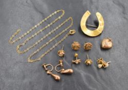 A pair of 9ct gold stud earrings of a circular textured design, sold along with a small assortment