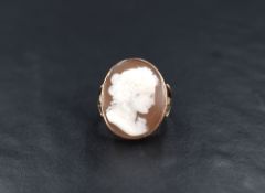 A rose metal shell cameo ring, the bezel set cameo depicting Antinous, a friend of Emperor